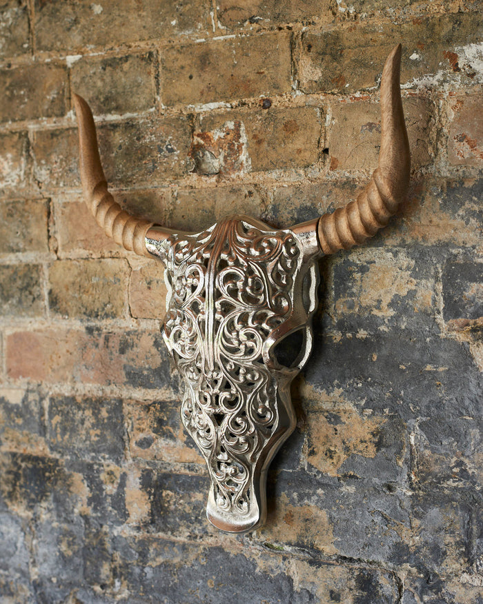 Decorative metal bulls head with carved wooden horns
