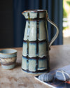 Blue/green Glazed stoneware water jug with black stripes