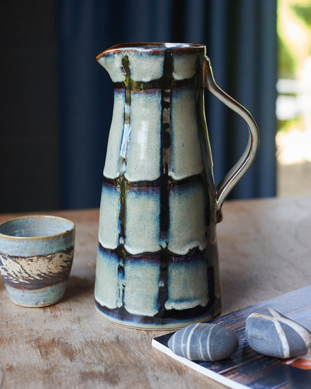 Blue/green Glazed stoneware water jug with black stripes