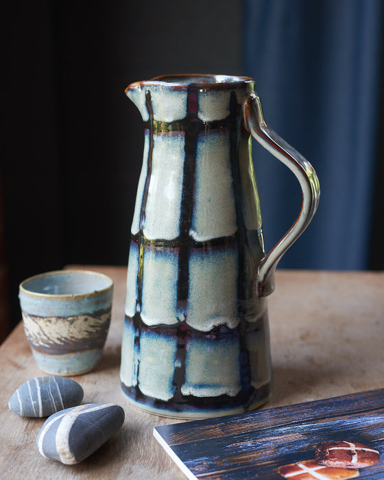 Blue/green Glazed stoneware water jug with black stripes