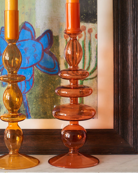 A Pair Of Burnt Orange Glass Candle Stick Holders