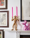 gold monkey candelabra with candles