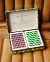 2 sets of playing cards presented in a retro box