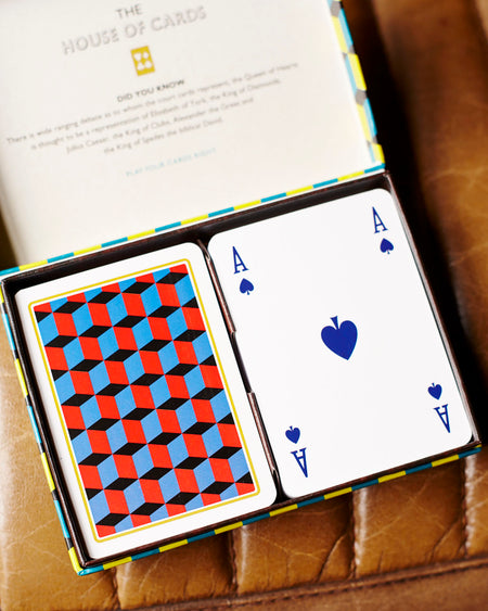 2 sets of playing cards presented in a retro box