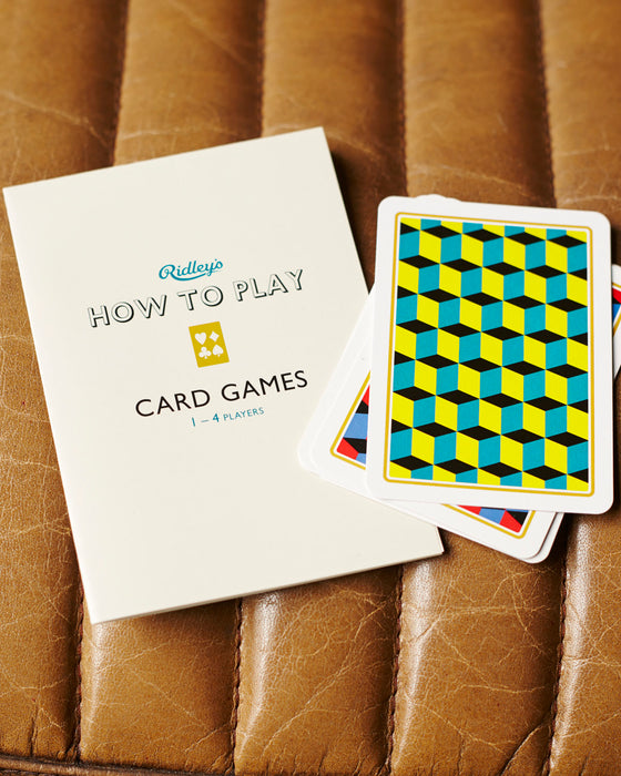 2 sets of playing cards presented in a retro box