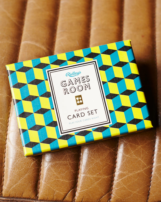 2 sets of playing cards presented in a retro box