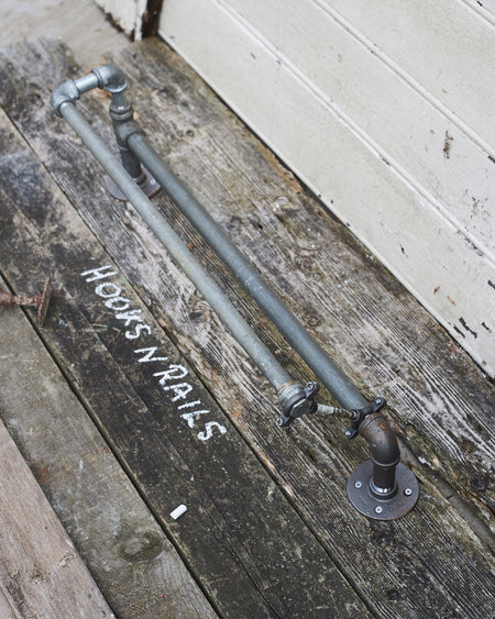 Industrial reclaimed metal towel rail 3/4-1/2 inch pipe.