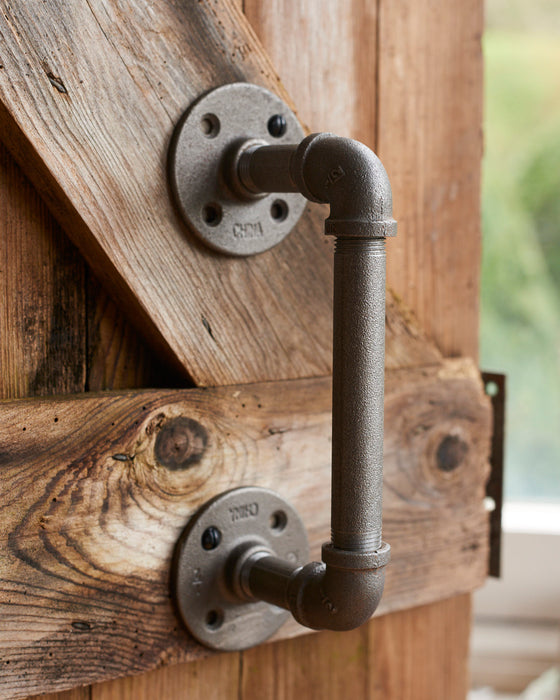 A pair of heavy duty industrial metal door handles