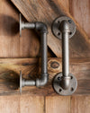 A pair of heavy duty industrial metal door handles