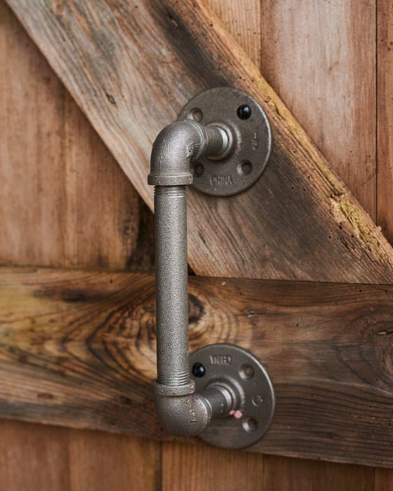 A pair of heavy duty industrial metal door handles