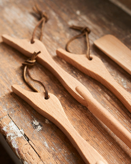 Long handled shoehorn in oiled beechwood with leather strap & Duck head handle