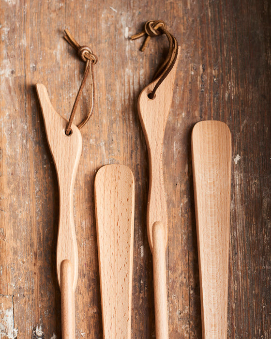 Long handled shoehorn in oiled beechwood with leather strap & Duck head handle