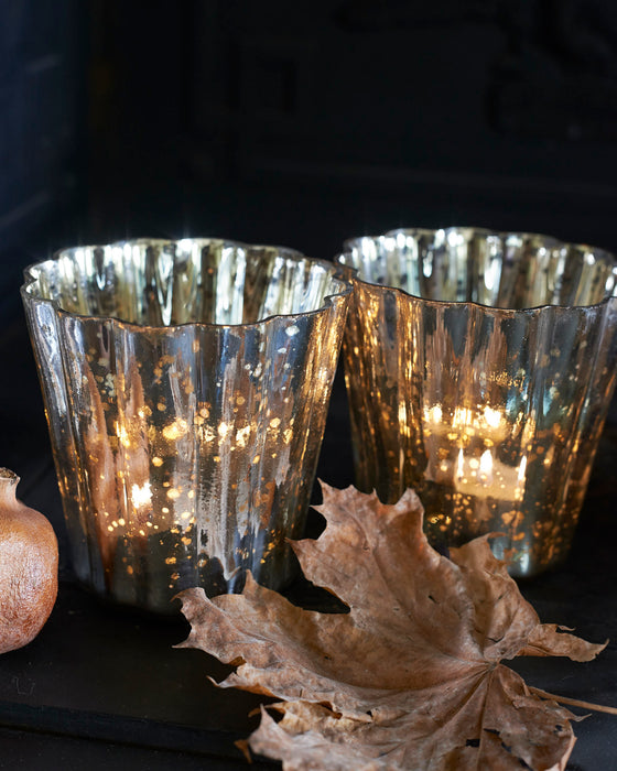 Large antiqued silver fluted votive t - light holders.