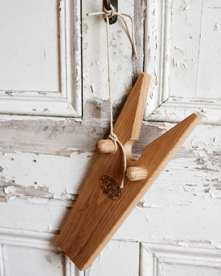 Solid oak wellington boot jack finished with natural oil