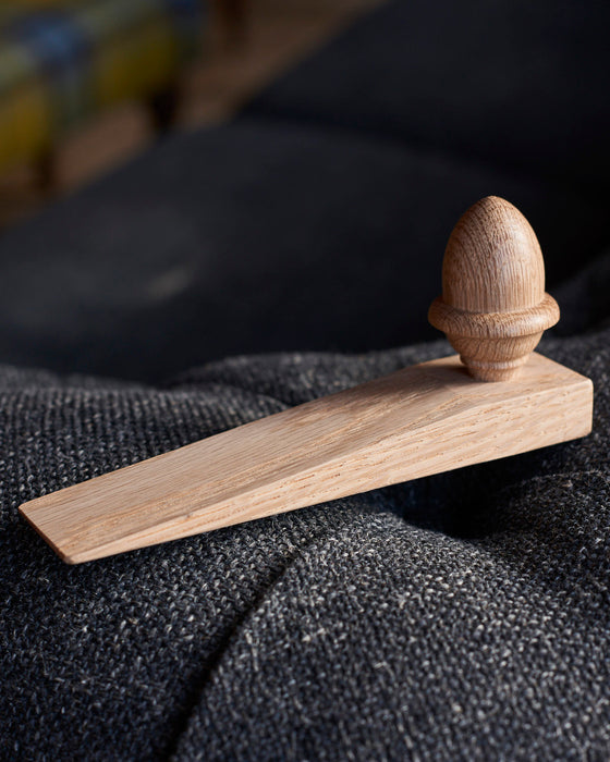 Solid Oak door wedge with turned acorn. Made in the UK