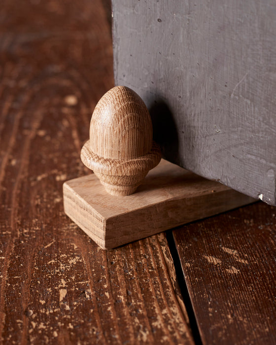 Solid Oak door wedge with turned acorn. Made in the UK