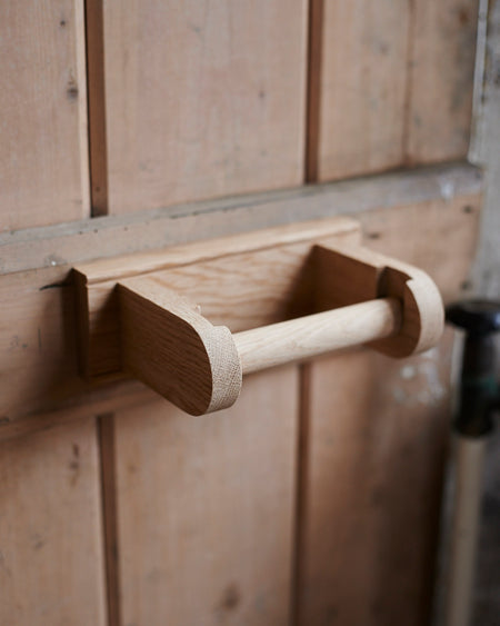 Handmade Oak loo roll holder.