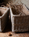 Large rattan log basket with industrial wheels and hessian liner