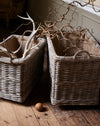 Large rattan log basket with industrial wheels and hessian liner