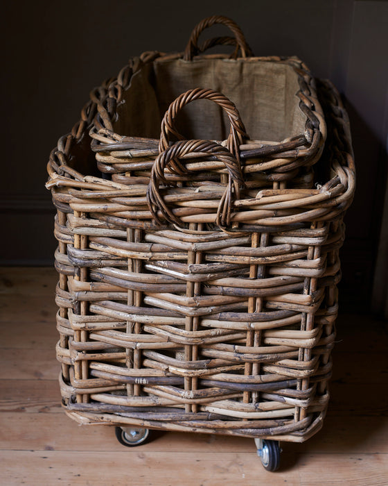 Large rustic rattan log baskets - wheels & hessian liner