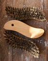 S - shaped oiled beechwood scrubbing utility brush.