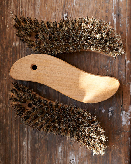 S - shaped oiled beechwood scrubbing utility brush.
