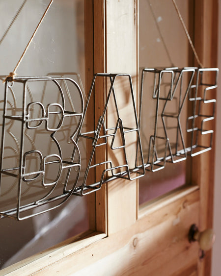 Zinc metal wire sign - BAKE.