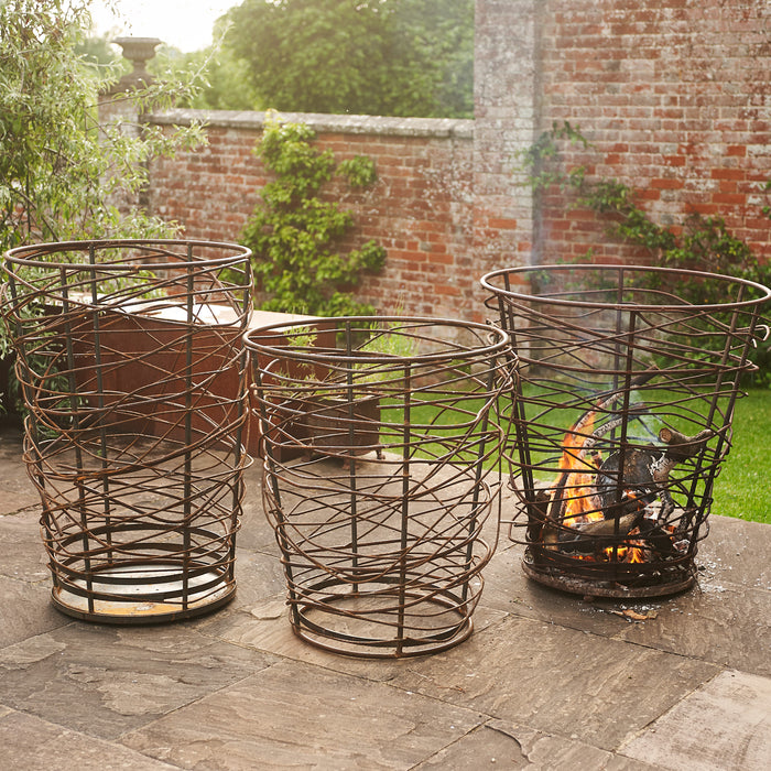 Bespoke twisted metal braziers 3 in a row