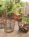 Bespoke twisted metal braziers 3 in a row