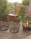 Bespoke twisted metal braziers 3 in a row