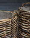 Large rattan log baskets with rope handles