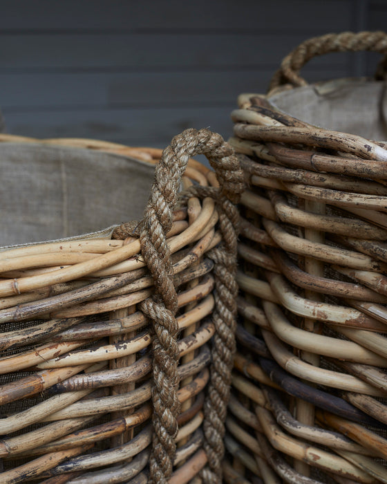 Large rattan log baskets with rope handles