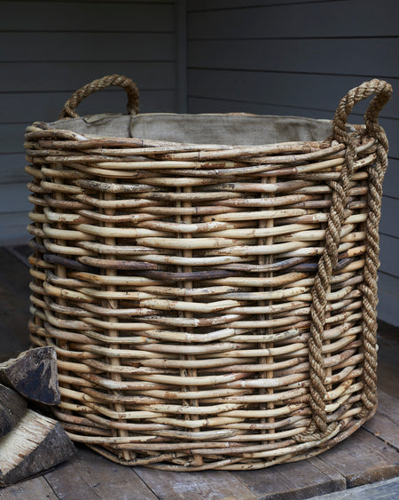 Large rattan log baskets with rope handles
