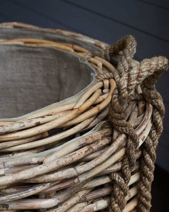 Large rattan log baskets with rope handles